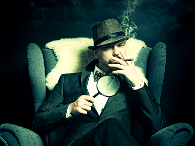 Sherlock-Holmes-sit-chair-cigar-magnifier.png